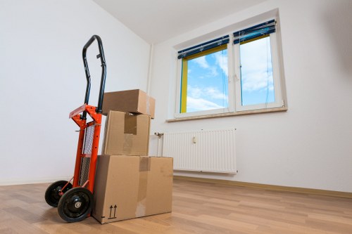 Local removal team unloading boxes at a Haringey property