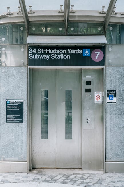 The image shows the platform at Seven Sisters railway station, with train tracks curving into a tunnel that is illuminated by sunlight from outside, creating a bright glow at the tunnel's entrance. To